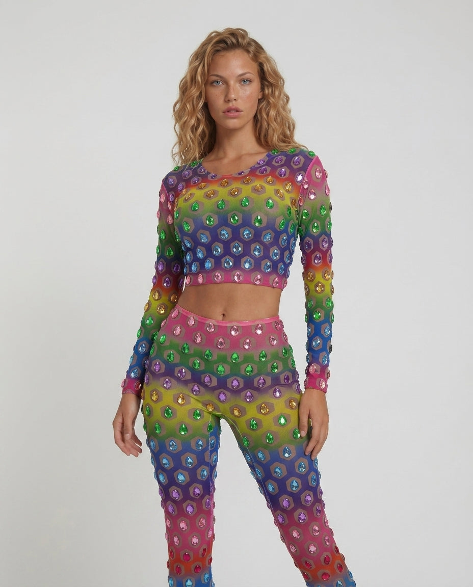 Multicolor rhinestone mesh 2-piece set with cropped top and flared pants on a model.