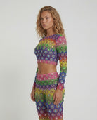 Multicolor rhinestone mesh 2 piece set with rainbow gradient, cropped top, and flared pants.