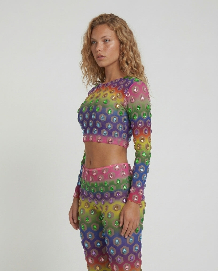 Multicolor rhinestone mesh 2 piece set with rainbow gradient, cropped top, and flared pants.