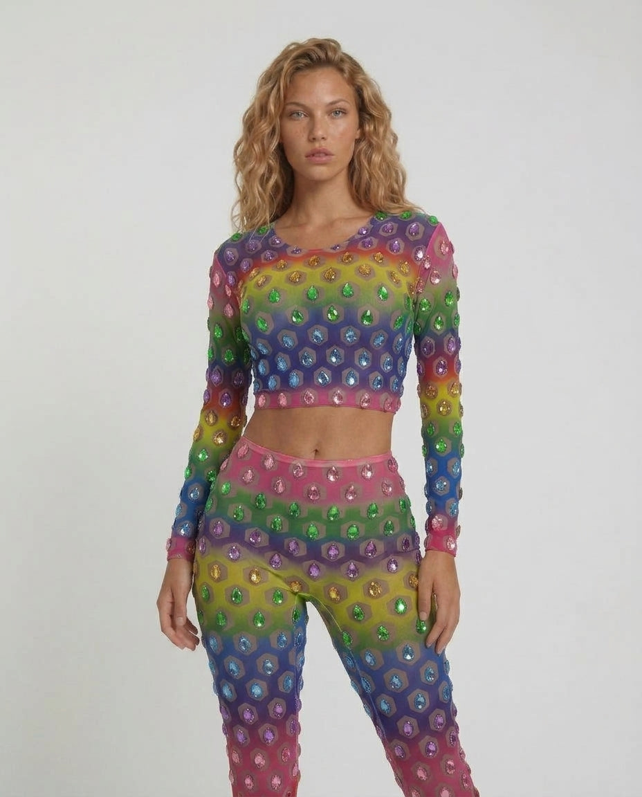Multicolor rhinestone mesh 2-piece set with cropped top and high-waisted flared pants on a model.