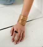 Model wearing a Multilayer Golden Bracelet
