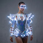Model wearing a futuristic silver iridescent LED bodysuit with rhinestone accents and matching light-up eyewear.