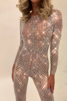 Nova Silver Rhinestone Jumpsuit, a full-coverage, long-sleeve, fitted jumpsuit with hand-glued rhinestones.