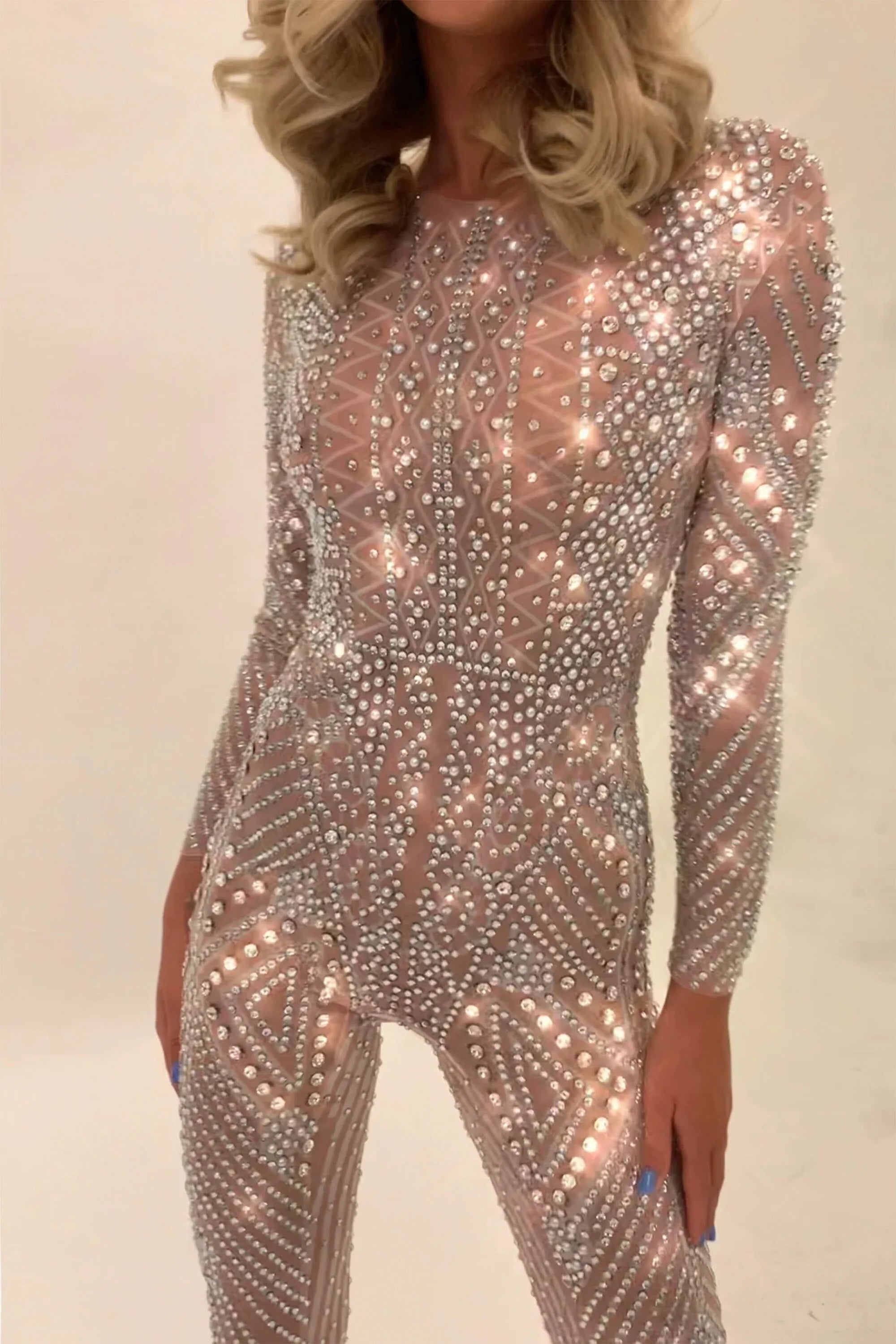 Nova Silver Rhinestone Jumpsuit, a full-coverage, long-sleeve, fitted jumpsuit with hand-glued rhinestones.