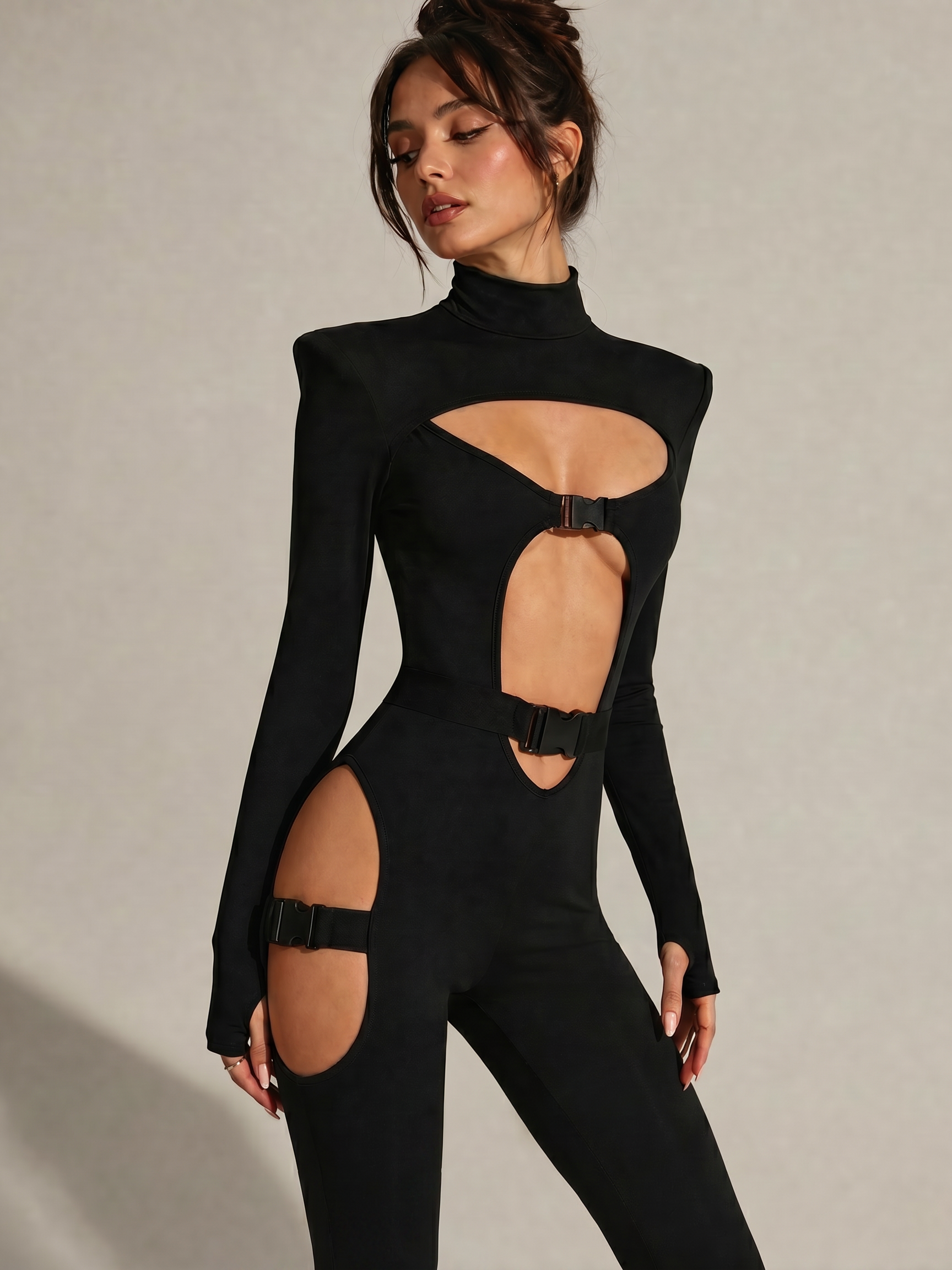Black Cyber Gothic Sexy Bodysuit with cut-outs, metallic buckles, and high neck.