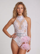 Pink sleeveless bodysuit with sheer tulle, intricate rhinestones, and a decorative tulle hip accent.
