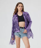 Purple metallic sequin jacket with long fringe trim, worn over a black crop top and denim shorts.