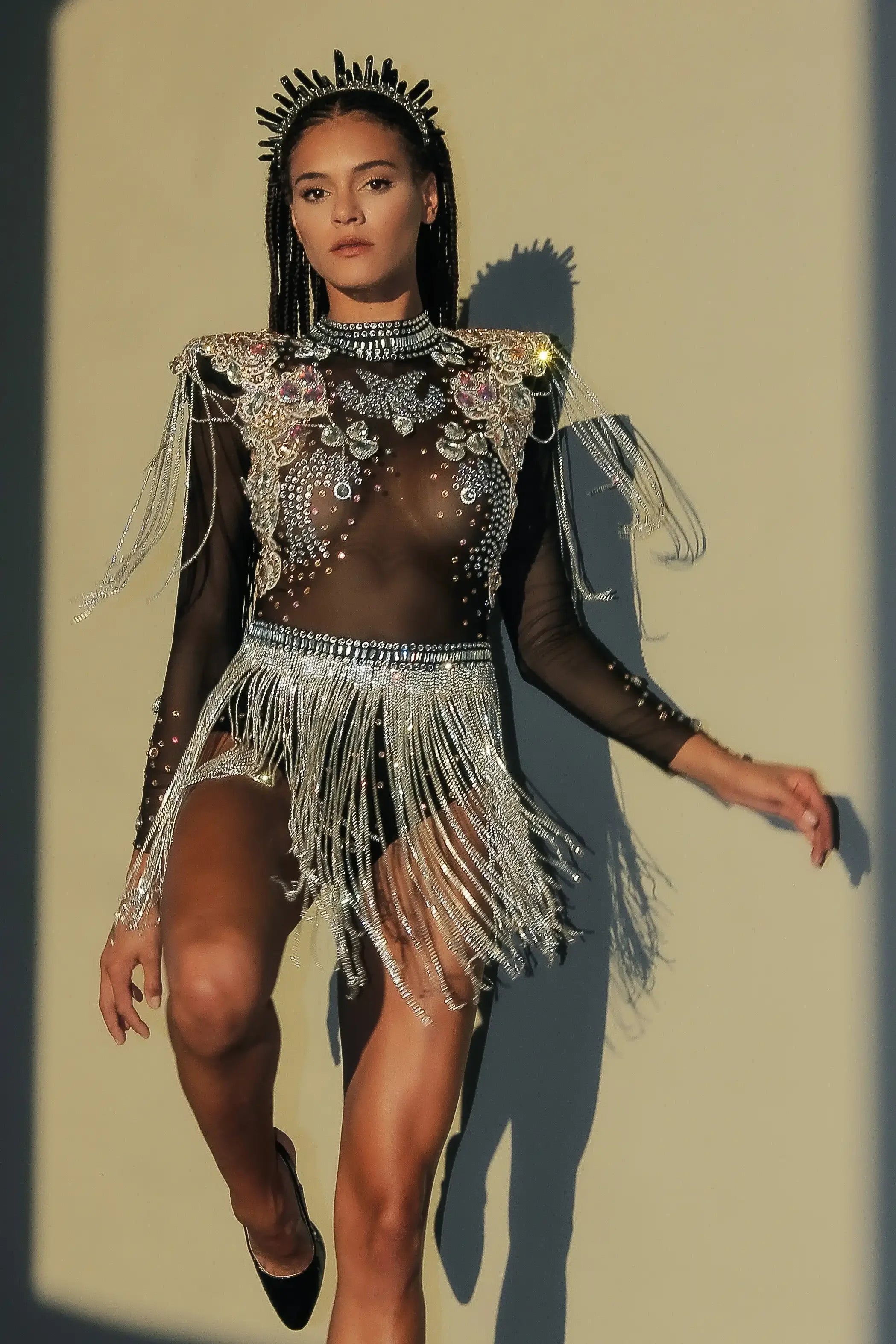 Stunning Rhinestone Tassel Festival Bodysuit featuring rhinestones, sequins, and flowing tassels.