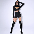 Black long-sleeve romper bodysuit featuring a front cutout, zipper detail, and stretchy fabric worn with tall boots.