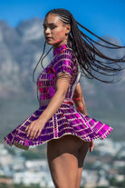 Model wearing a Sequin Rhinestone Festival Mini Dress, showcasing vibrant colors and playful movement.