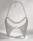 Silver chainmail-style bralette with halter neck, central ring, and adjustable clasp.