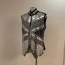 Silver mirror rhinestone men's vest with geometric panels and hand-glued rhinestones on a black polyester base.