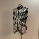 Silver mirror rhinestone men's vest with geometric panels and hand-glued rhinestones on a black polyester base.