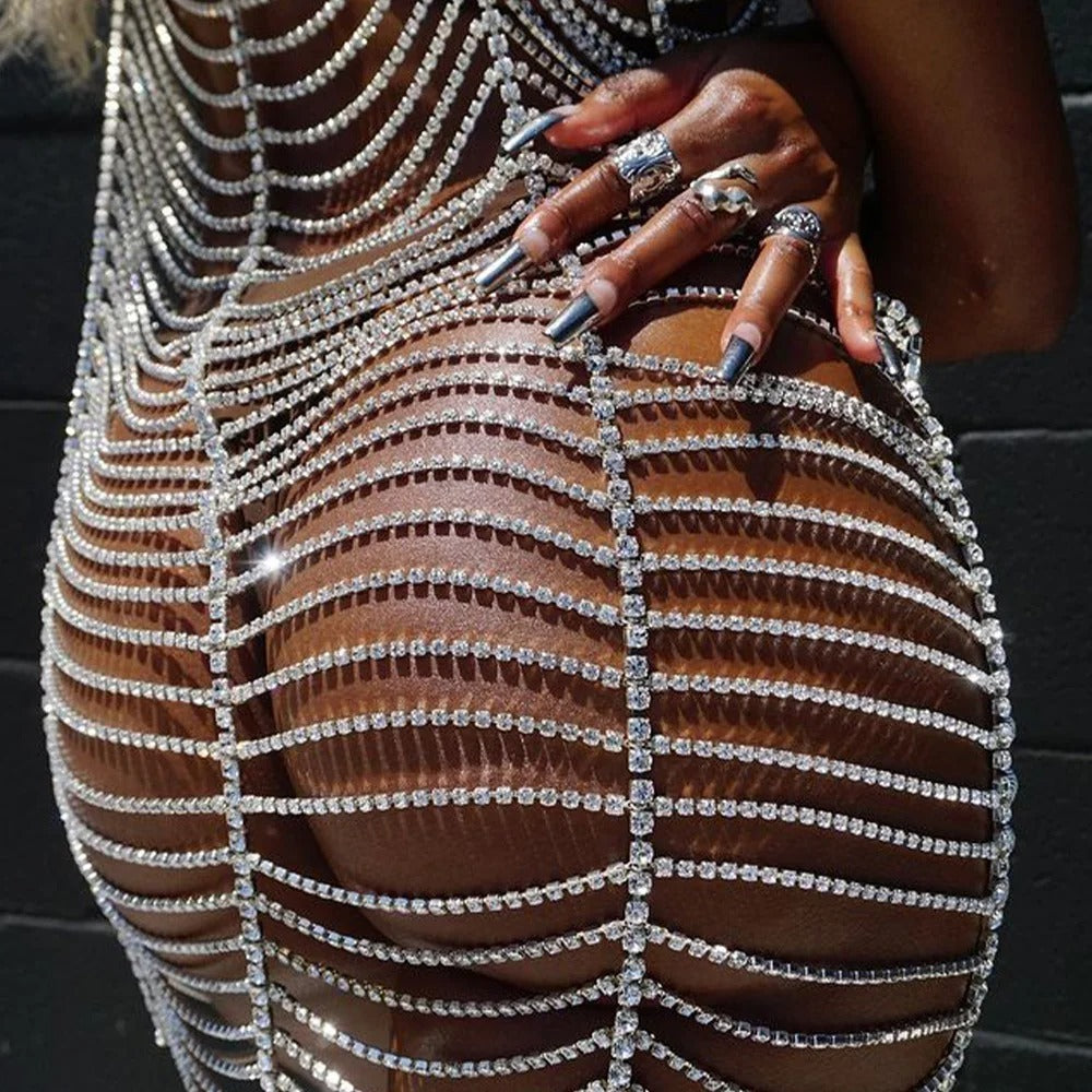 Close-up of Silver Sparkling Rhinestone Dress showcasing rhinestone detailing and curve-hugging design.