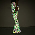 Slim Fit Reflective Bodycon Pants showcasing vibrant design, glowing under black light.
