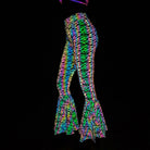 Slim Fit Reflective Bodycon Pants with vibrant rainbow colors and flared hem, ideal for rave outfits.