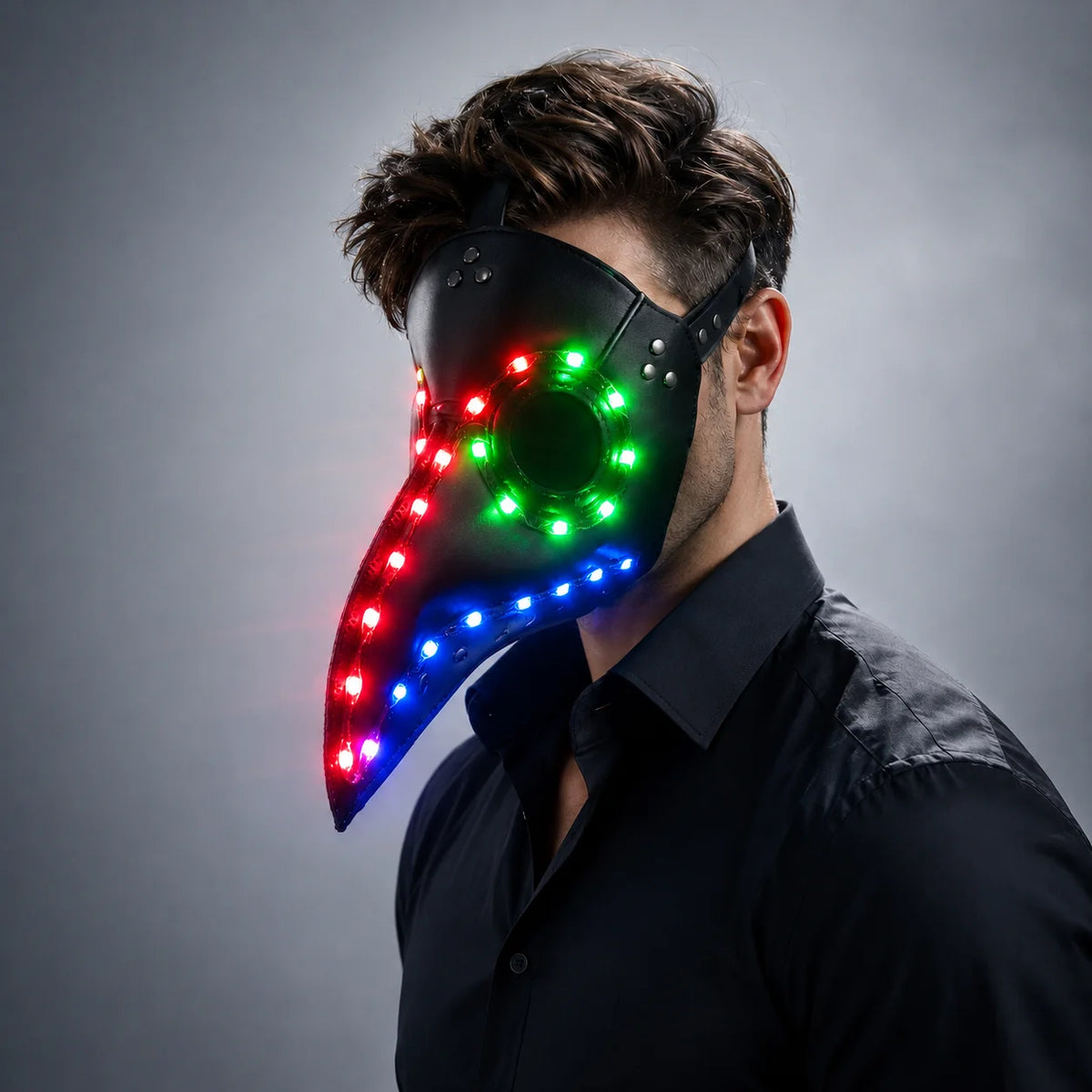 Black faux-leather steampunk plague doctor mask featuring vibrant, multi-colored LED lights and an adjustable strap.
