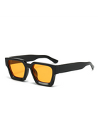 Unisex Malmö chunky square sunglasses featuring a black polycarbonate frame and vibrant orange UV-400 resin lenses.