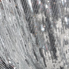 Détail de la veste à sequins avec franges