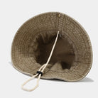 Vista interior del sombrero tipo pescador Washed Fishman que muestra el cordón ajustable y el material suave de algodón.
