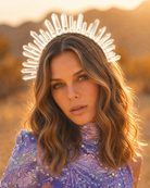 Woman wearing a white crystal quartz headband crown in a desert sunset.