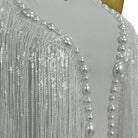Body en dentelle à franges de perles blanches et de sequins