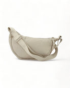 Casual Crossbody Bag in beige nylon, stylish and functional accessory for festivals and events.