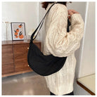 Casual Crossbody Bag worn over a knitted sweater, ideal for stylish festival outfits.