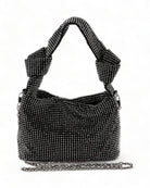 Bolso Diamond Knot con correa anudada fija y acabado de malla de diamantes brillante, ideal para conjuntos elegantes.