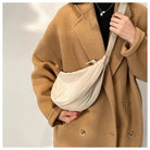 Woman wearing a Casual Crossbody Bag with a stylish coat, showcasing a trendy and functional accessory.