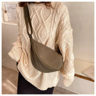 Casual Crossbody Bag worn with a cozy knitted sweater, showcasing stylish festival accessory.
